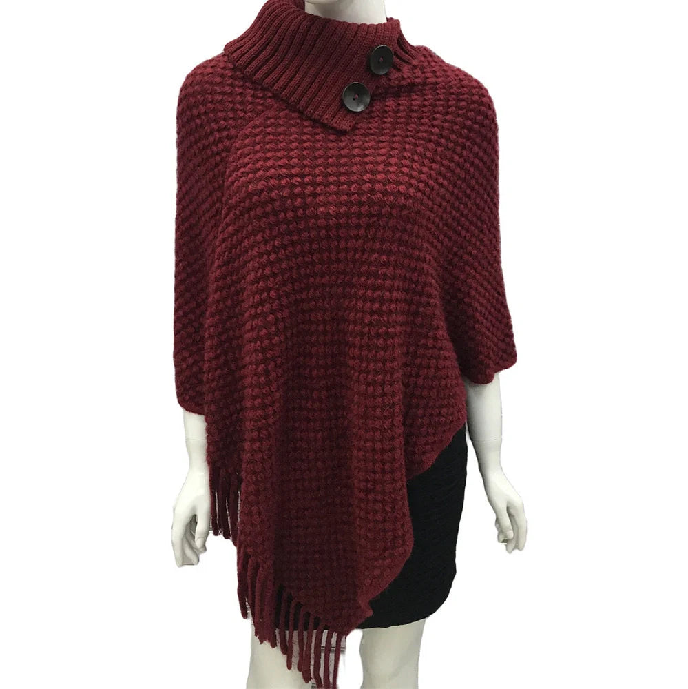 Sleeveless polka dot shawl in apricot colour draped over chair, showing 150cm length and acrylic fibre texture