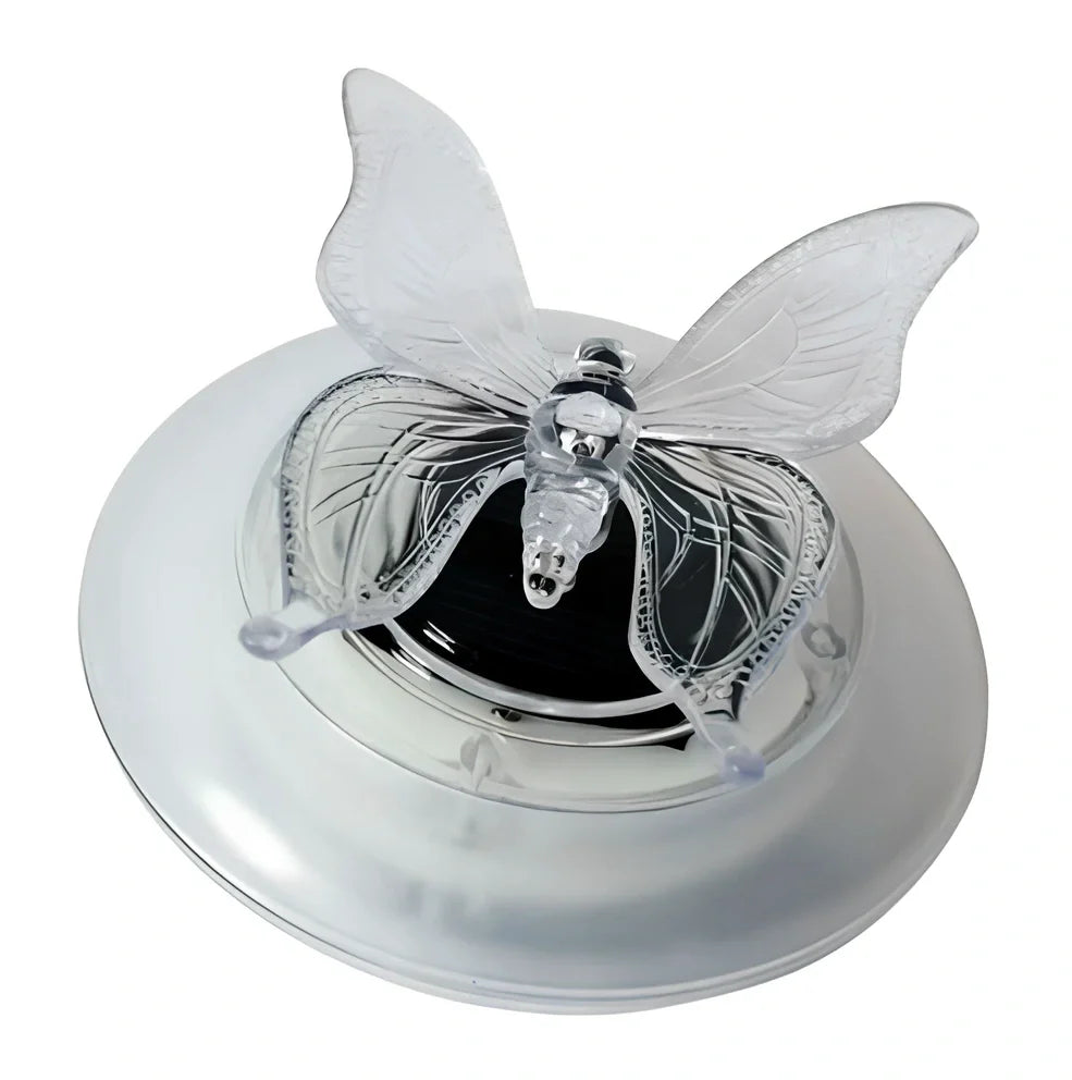 Solar LED float lamp with butterfly design floating on garden pond water surface