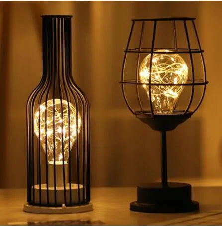 Minimalist hollow iron table lamp with warm white LED light in red wine glass design