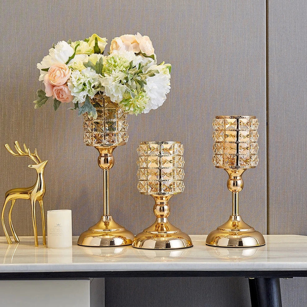 Three golden metal candle holders in small 21 cm, medium 31 cm, and large 36 cm sizes with 11x11 cm bases for table decor