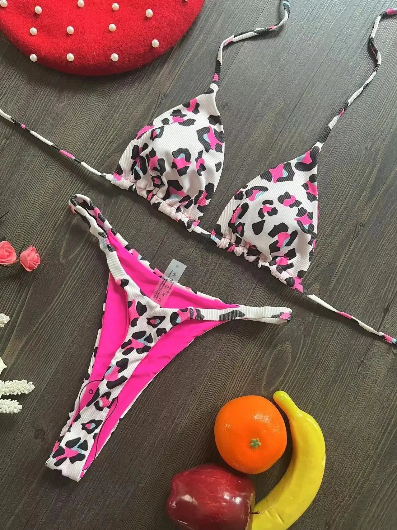Women's printed bikini swimsuit with briefs style and cotton lining on a mannequin.