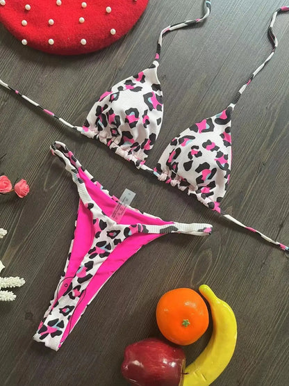 Women's printed bikini swimsuit with briefs style and cotton lining on a mannequin.