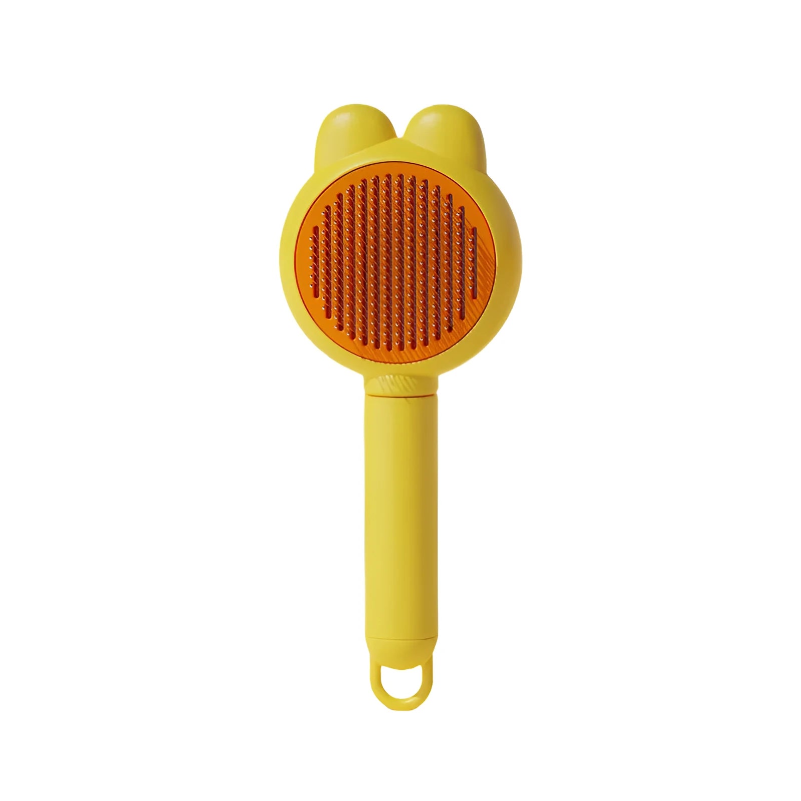 Green self-cleaning pet grooming brush with a release button and rubber-tipped metal pins on a non-slip handle.