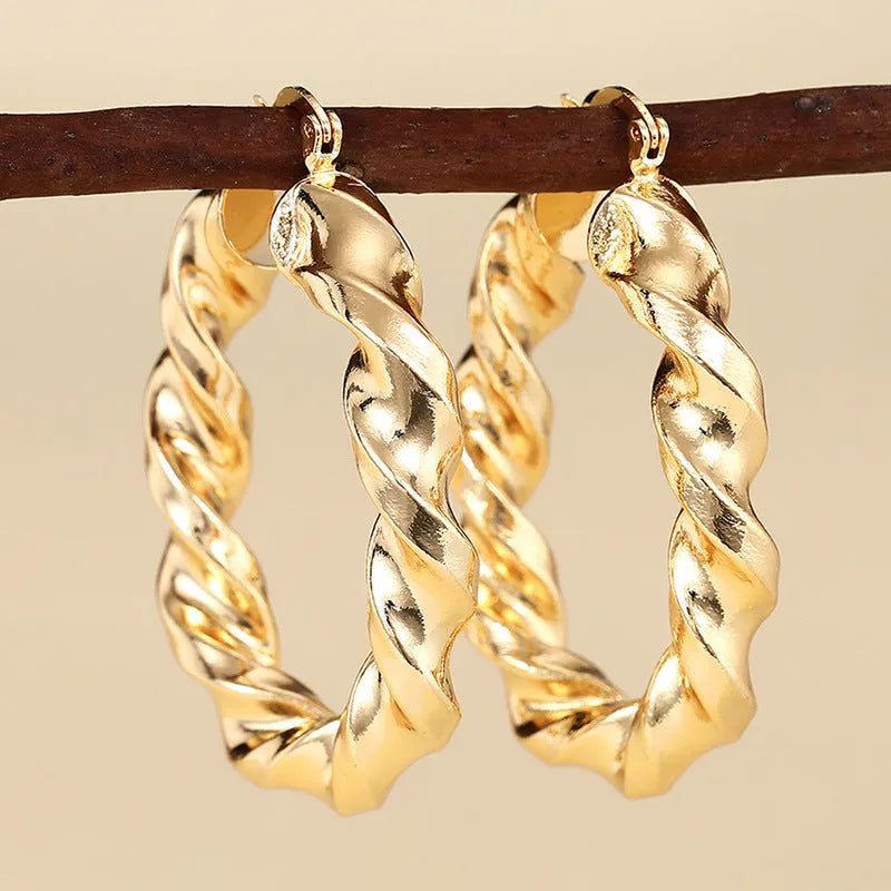 Geometric drop-shaped ear clip earrings with electroplated finish in various colours