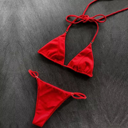 Women's split bikini in nylon for swimming and sports, available in red, blue, and snakeskin patterns.