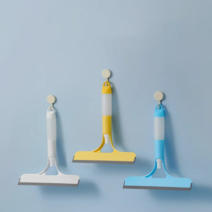 Double-sided plastic glass scraper in sky blue, 15cm long for removing household water stains