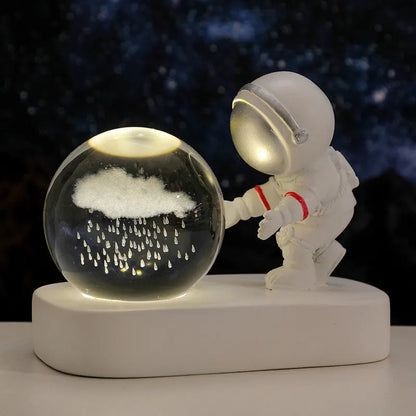 Astronaut crystal ball night light projecting galaxy pattern on 6cm resin sphere with USB cable