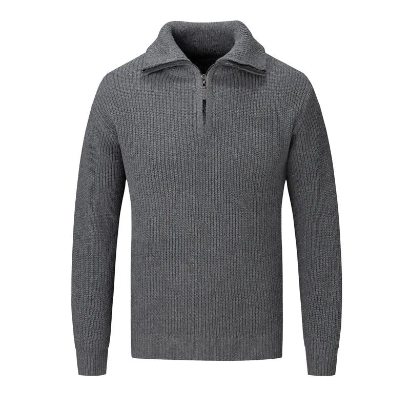 A man wearing a solid-colour slim-fit loose pullover sweater in a neutral colour.