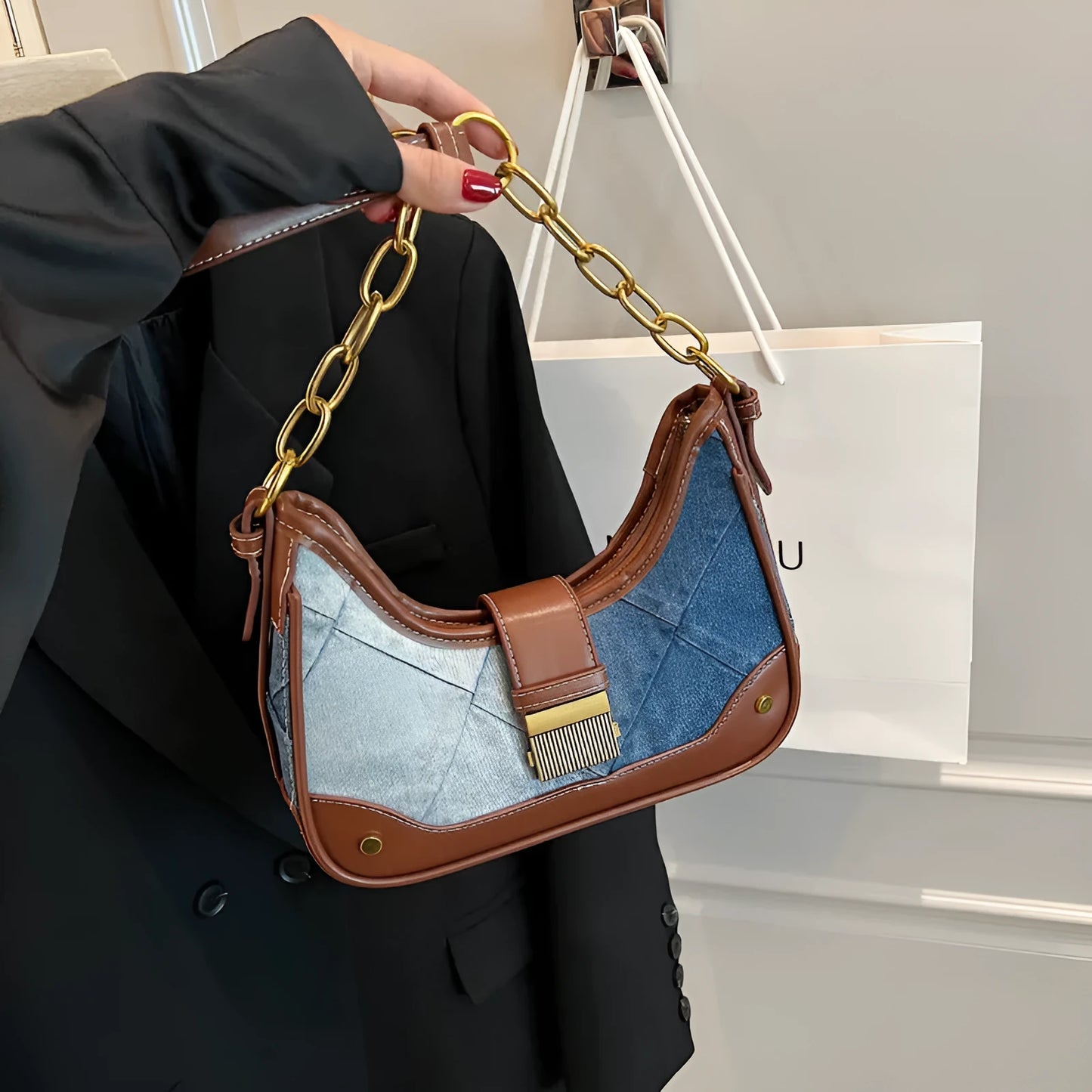 Brown denim women's bucket shoulder bag with diamond mesh detail and chain straps