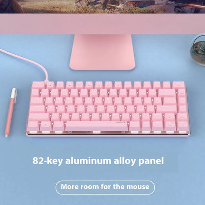 Pink mechanical keyboard with 82 keys and white backlight illumination on a desk.