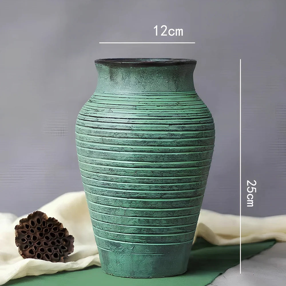 Ceramic mosaic vase with dried flowers, showing mosaic pattern and 25cm height