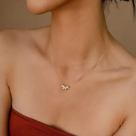 Minimalist lotus flower petal necklace in gold or silver, perfect for women and girls.