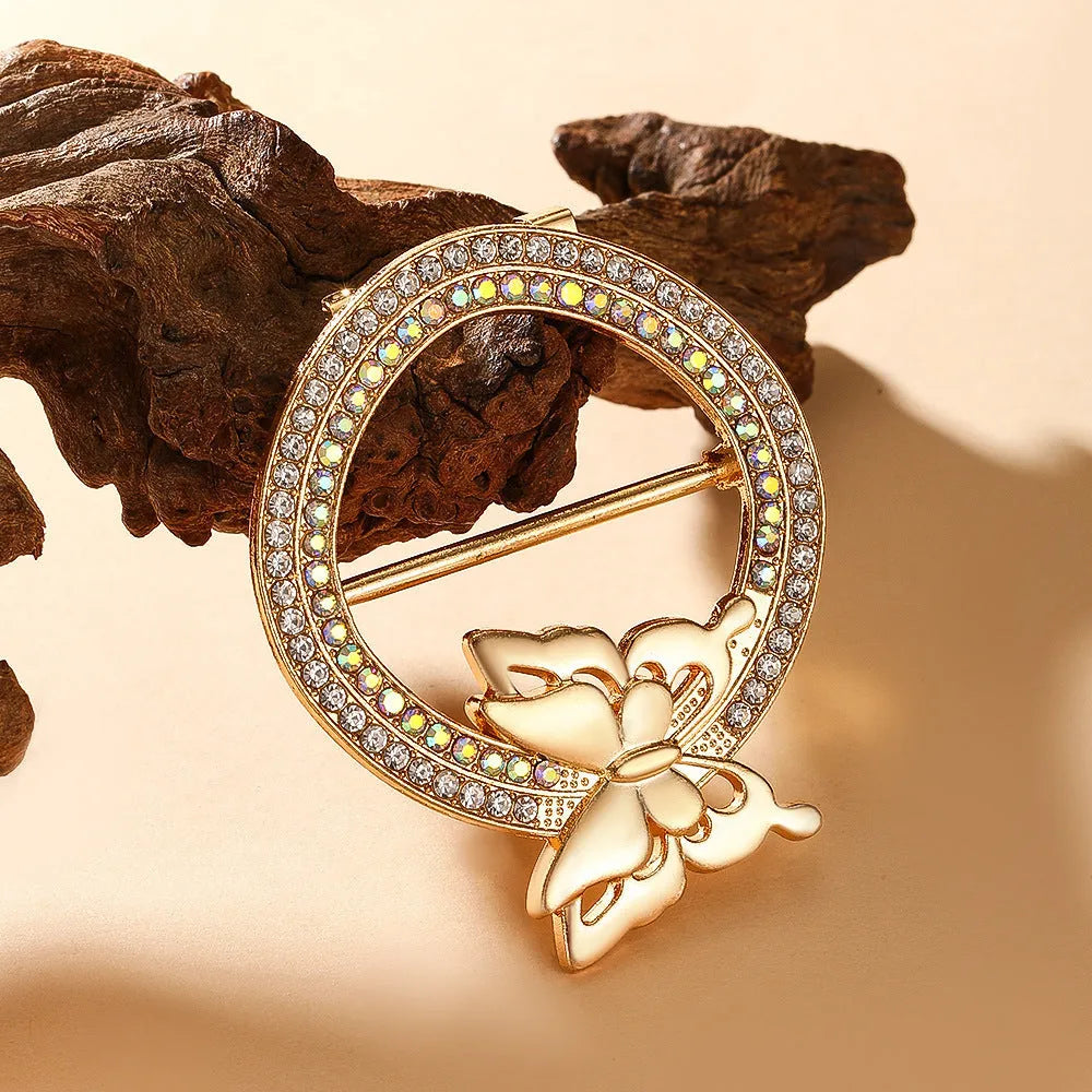 Bow-shaped waist-cinching accessory clip for high-end brooches, alloy with electroplating and diamond inlay, shown in gold, silver, or rose gold finishes.