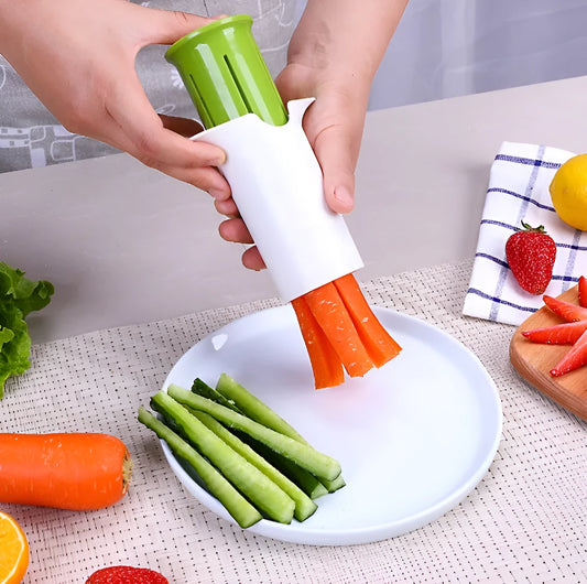 White plastic vegetable and fruit slicer with six stainless steel blades for cutting cucumbers and carrots.