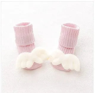 Cotton baby floor socks in assorted colours and patterns including bows, stars, and animal designs.