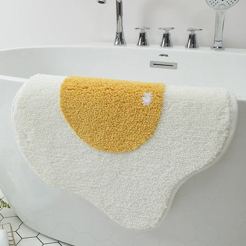 Stylish and functional egg-shaped area rug with a playful design, perfect for adding charm and protecting floors in your home.