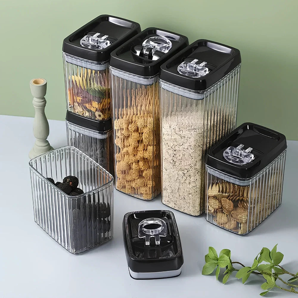 Six black food storage containers with lids in two sizes: two large 3.3-litre and four smaller 1.5-litre jars