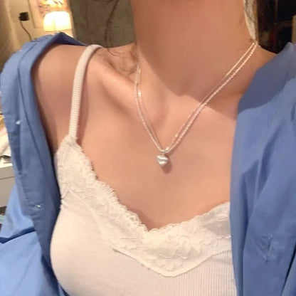 Double-layer brushed heart pendant necklace on adjustable silver-toned chain