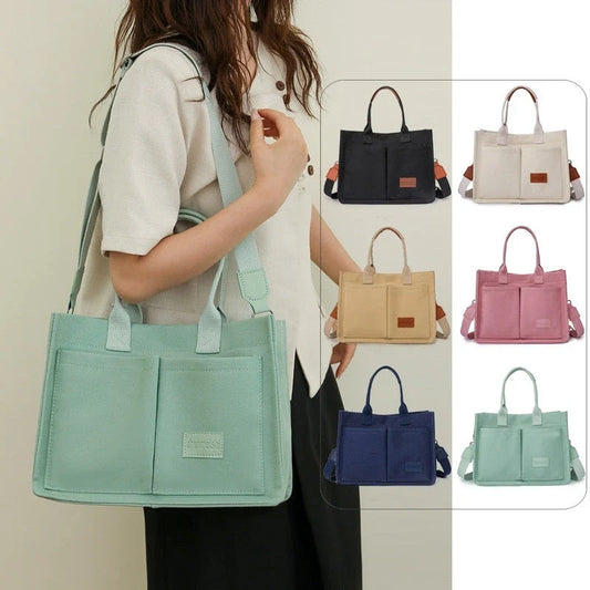 Premium canvas tote bag in multiple colors with adjustable shoulder strap and organizational pockets