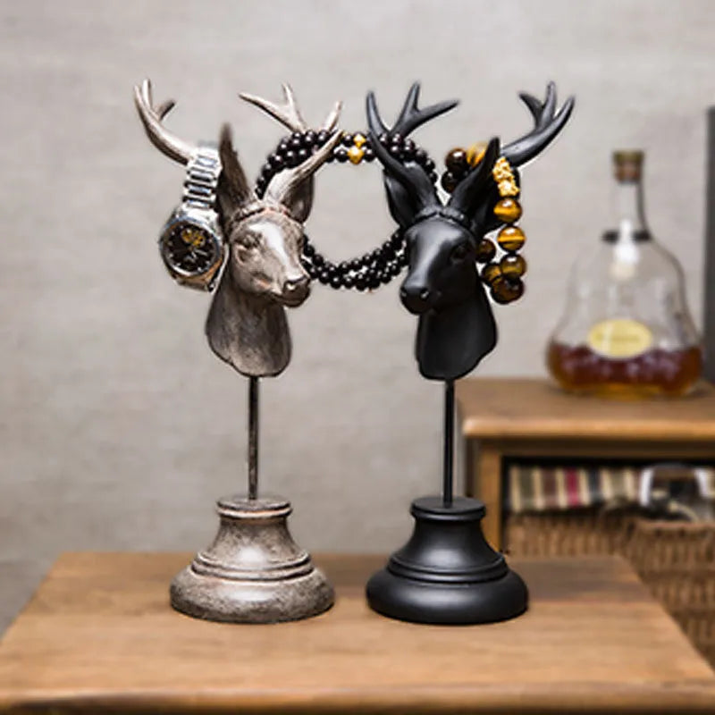 Natural resin animal sculpture home decoration in black, white, and wood colour finishes.