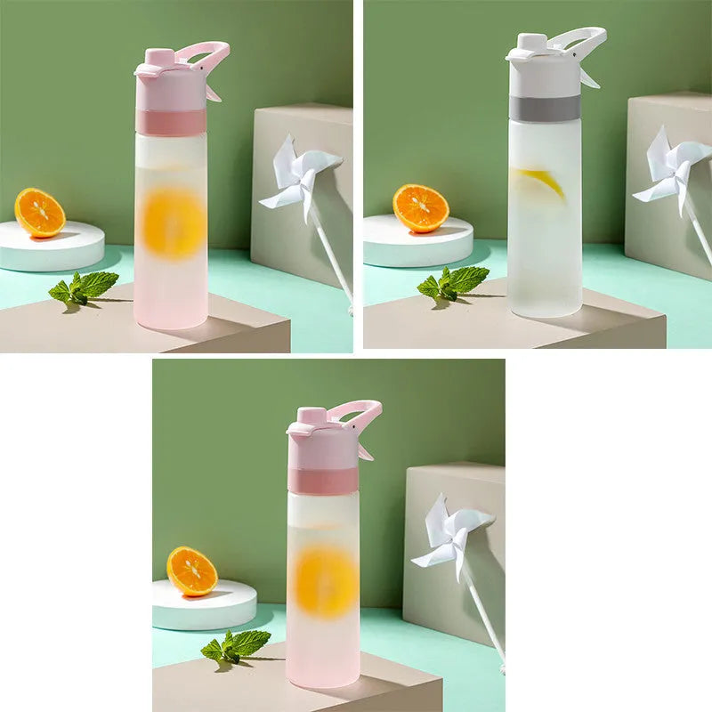 Large plastic spray water bottle with handle strap and leakproof lid in green colour.