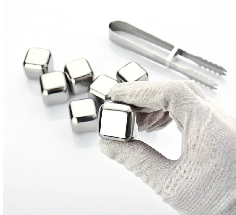 Set of eight stainless steel whiskey cooling stones with metal clip in plastic storage container
