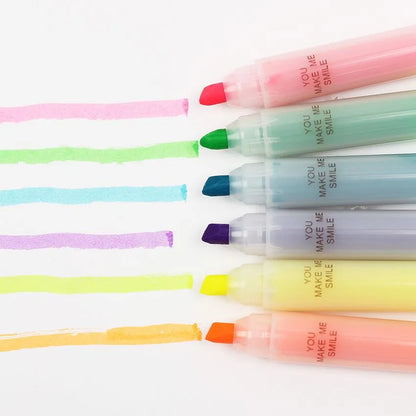 Set of six slanted plastic highlighter pens showing six different fluorescent ink colours.