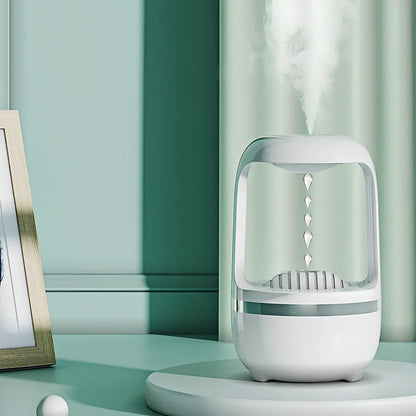 White anti-gravity humidifier showing upward water droplets with 500ml tank and USB-C cable