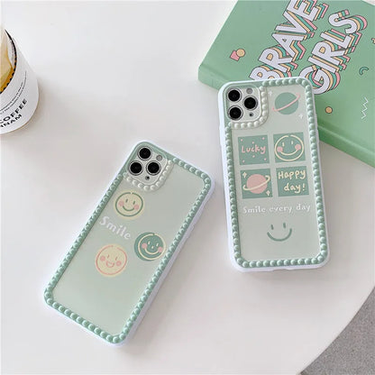Green TPU iPhone case with geometric smiley face and polka dot frame design on a smartphone