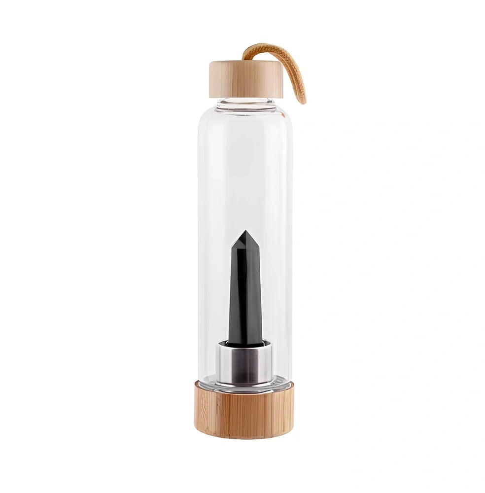 Crystal infused glass water bottle with bamboo lid showing mineral crystal inside 25cm tall container