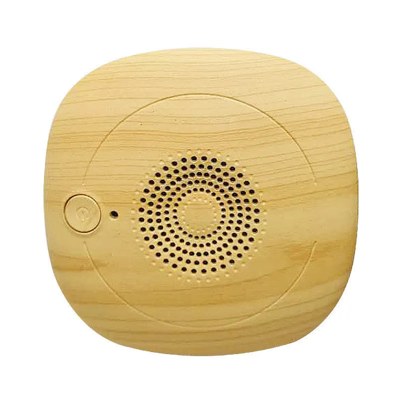 Black and wood grain ultrasonic bed vacuum cleaner for mite control on a mattress