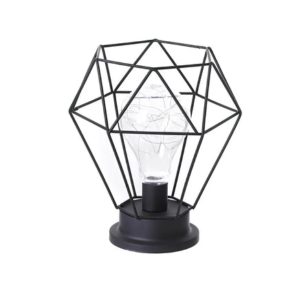 Minimalist hollow table lamp in red wine bottle design with wrought iron construction and warm white LED illumination