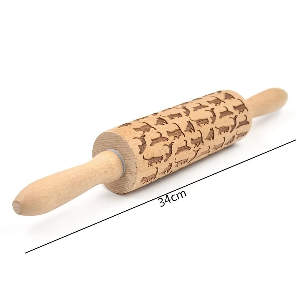 Wooden rolling pin with engraved Christmas patterns including reindeer and snowflakes on a 45cm long barrel.