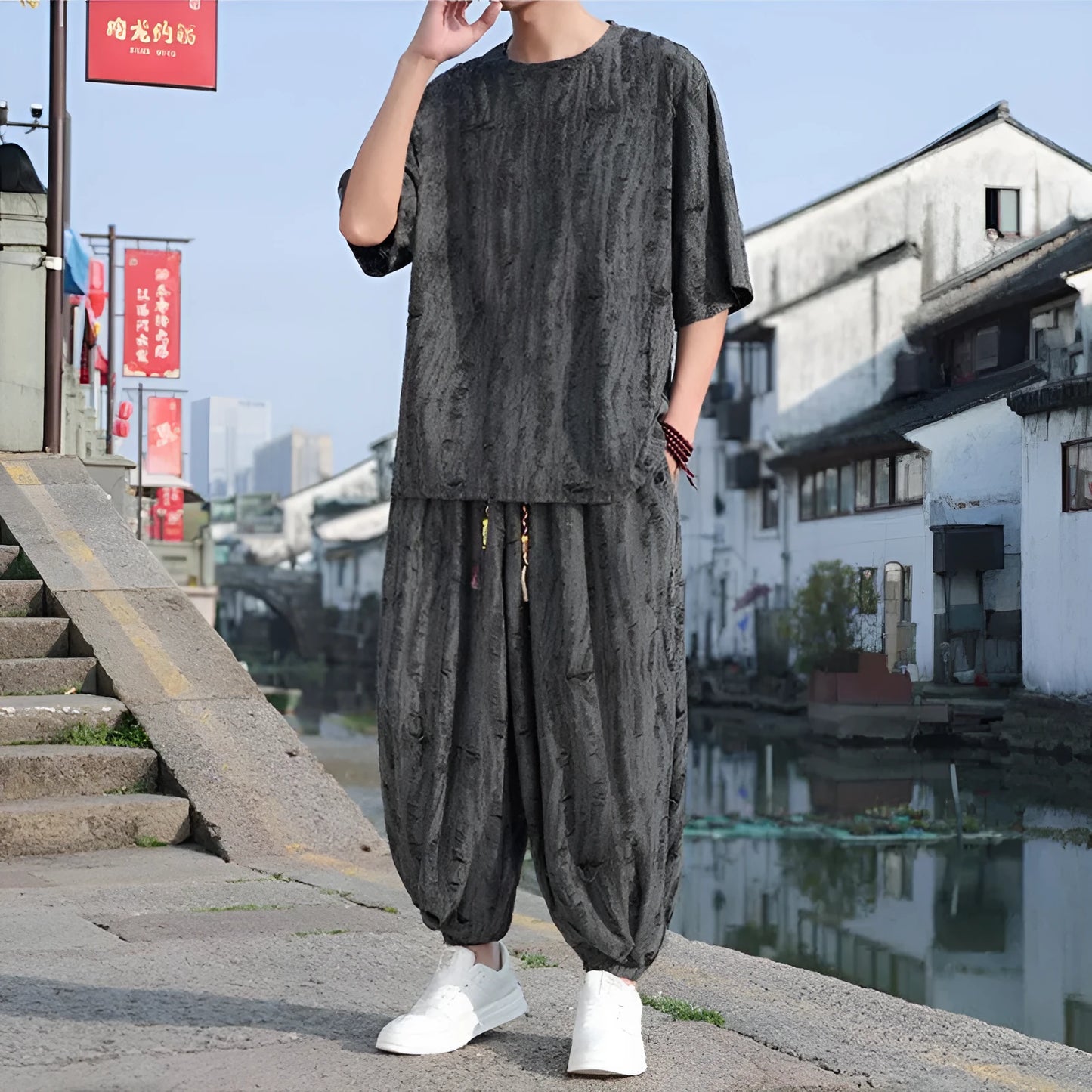 Men's black and grey knitted short-sleeve top with matching loose cropped trousers casual suit set