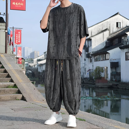 Men's black and grey knitted short-sleeve top with matching loose cropped trousers casual suit set