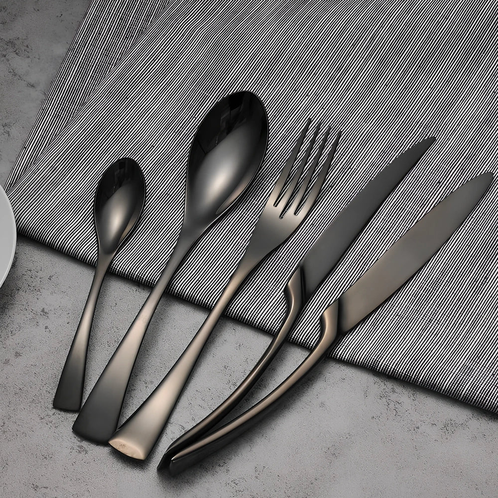 Four-piece black stainless steel cutlery set with mirror polishing showing fork, knife, coffee spoon, and soup spoon