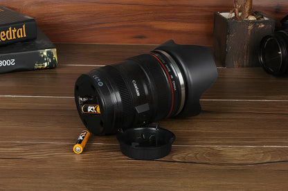 Self-stirring camera lens mug with stainless steel construction and automatic mixing button