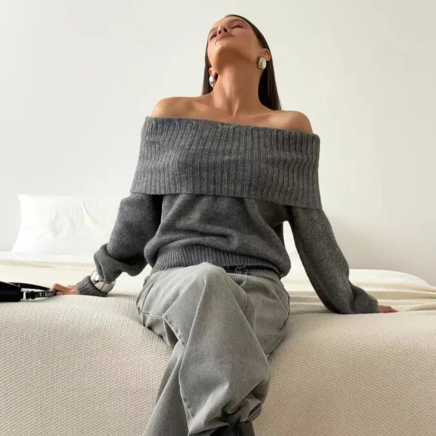Grey off-shoulder acrylic sweater with 3D pattern texture, showing strapless design and regular sleeves