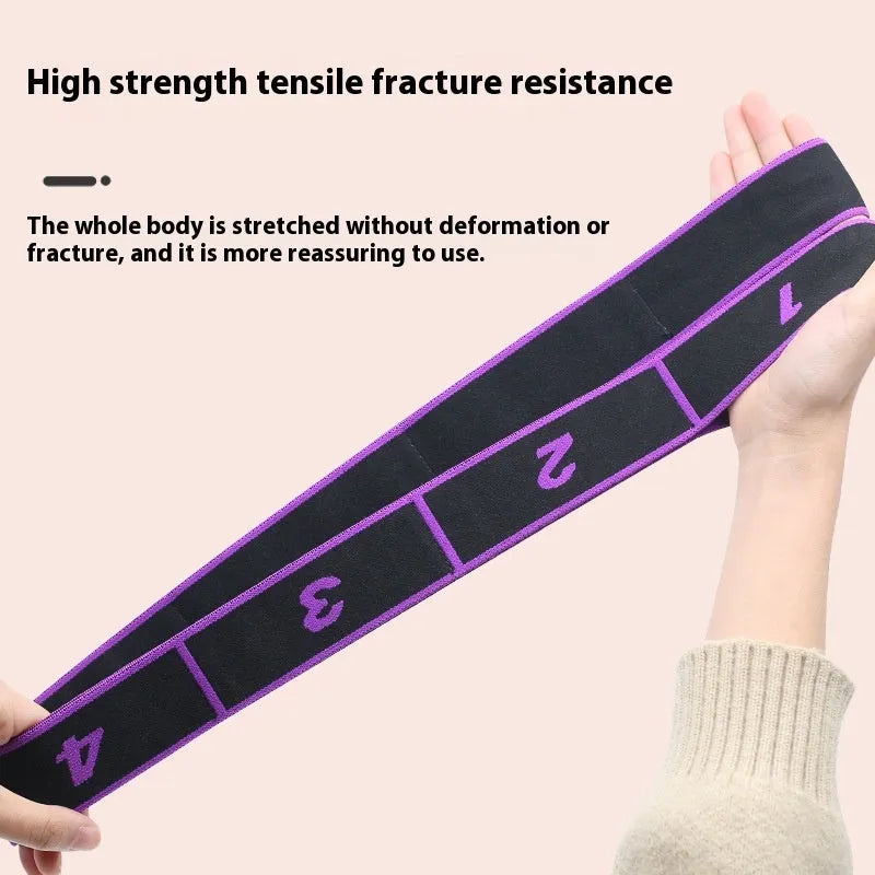Blue multi-section yoga stretch strap for Pilates and dance exercises on a wooden floor