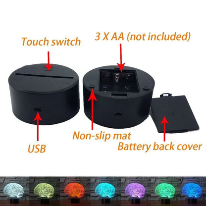 3D brain-shaped LED lamp with colour changing modes and remote control on wooden surface