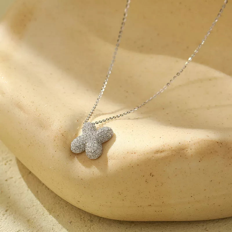 Stainless steel initial pendant necklace with zircon accents, personalized with your choice of letter.