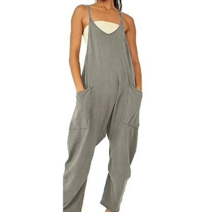 Sleeveless jumpsuit with spaghetti straps, pockets, and zipper closure in various colors