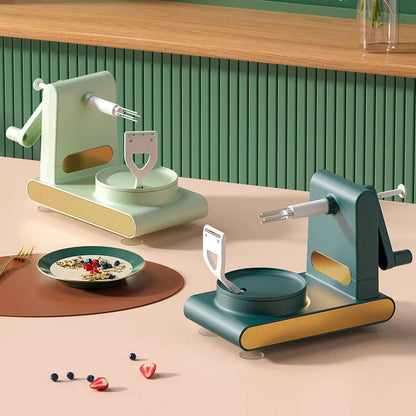 Hand-cranked ABS plastic peeler machine with suction cup base in light green colour