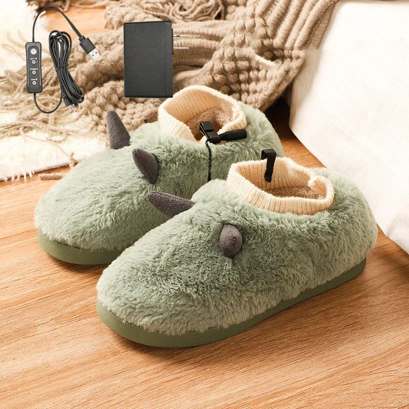 A pair of grey USB heated slippers with a connected cable, showing the soft velvet upper and plastic sole.