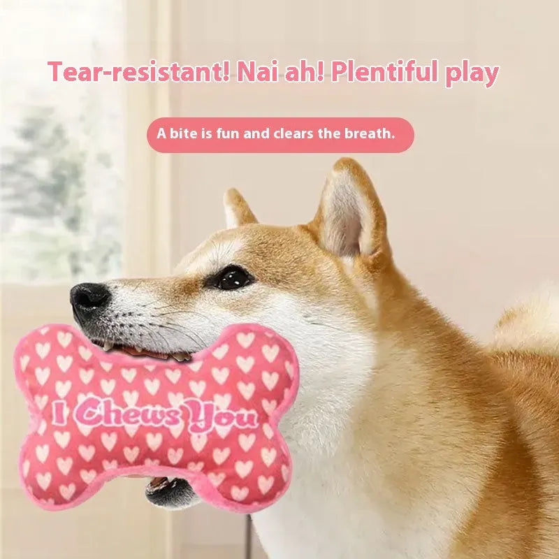 Plush pet dental toy in peach heart pink colour with textured surface for tooth cleaning, 15cm length