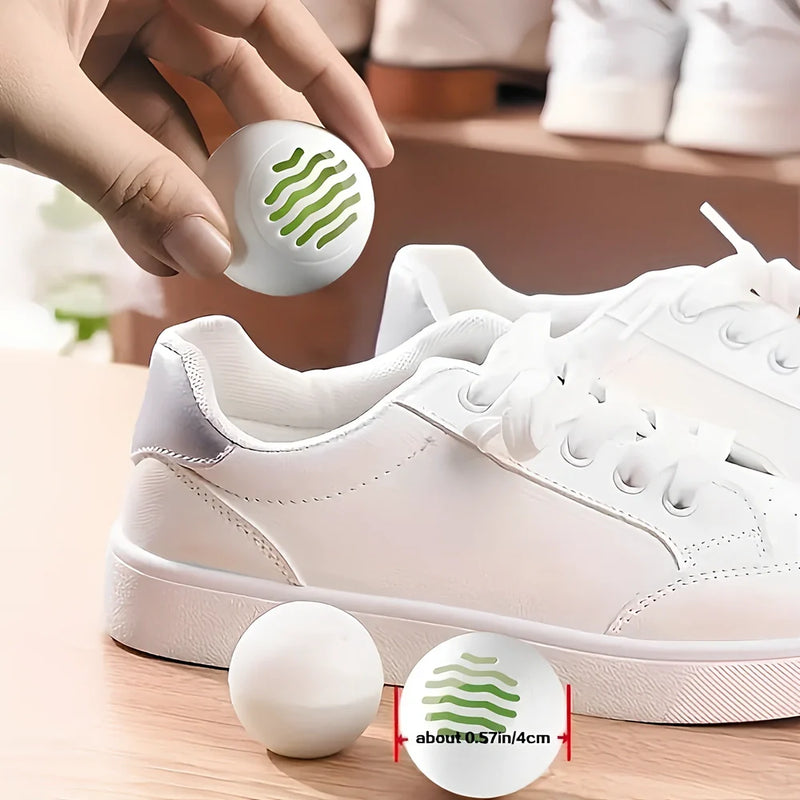 Shoe deodorant balls with green tea scent that eliminate odours for up to 30 days, suitable for shoes, gym bags, and small spaces with easy twist-to-activate mechanism