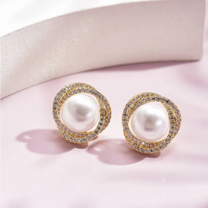 Rose pearl stud earrings with silver needle, rhinestone inlay, copper geometric circle design, white or yellow gold colour.