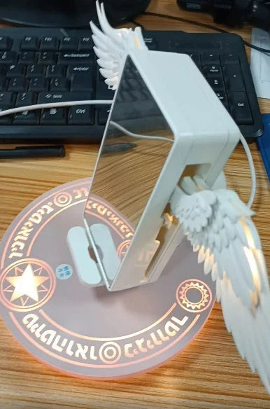 Angelic wireless charger with unfolding wings, providing fast charging and elegant design for smartphones