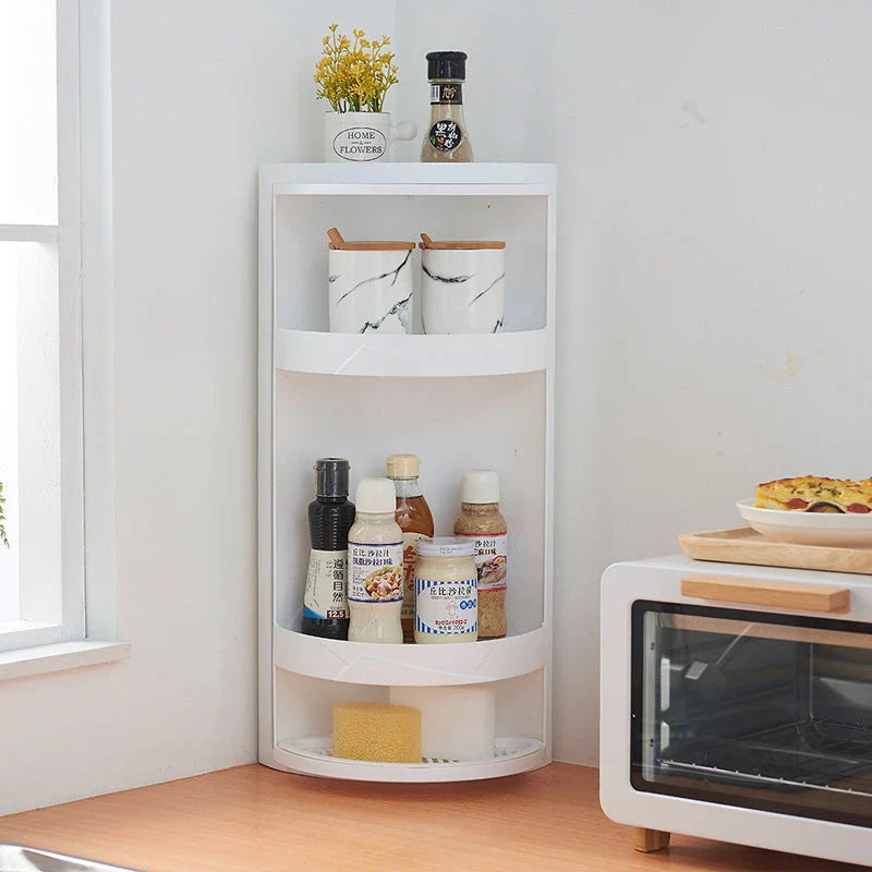 Rotatable bathroom storage organizer with a sleek, white plastic design and a covered front panel to protect against dust.