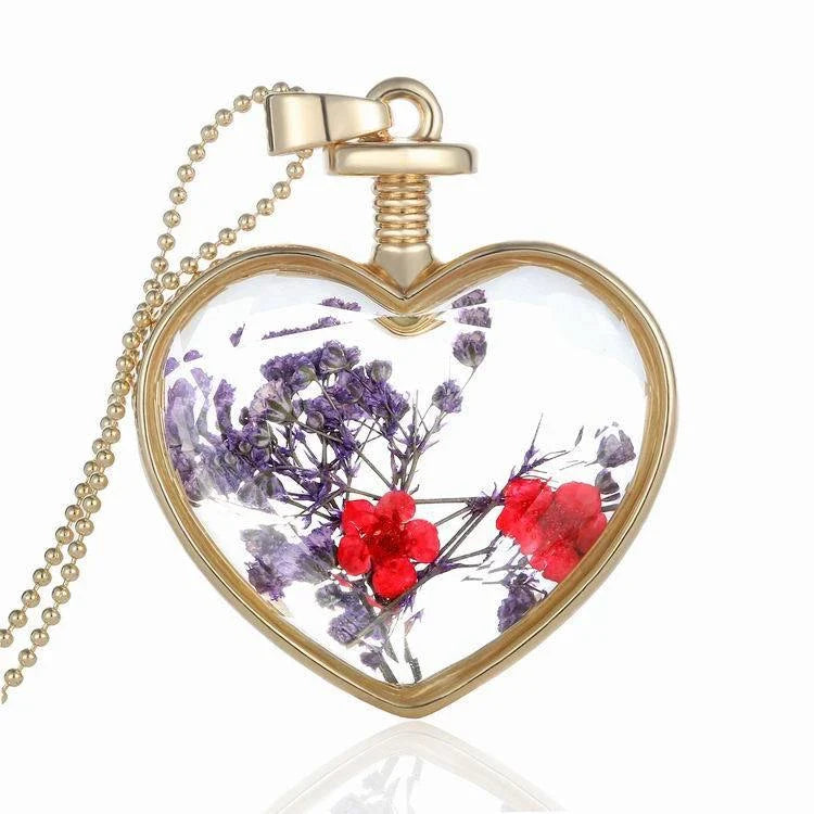 Elegant round pendant necklace with dried flower specimen in various colors including yellow, blue, purple, red, and orange